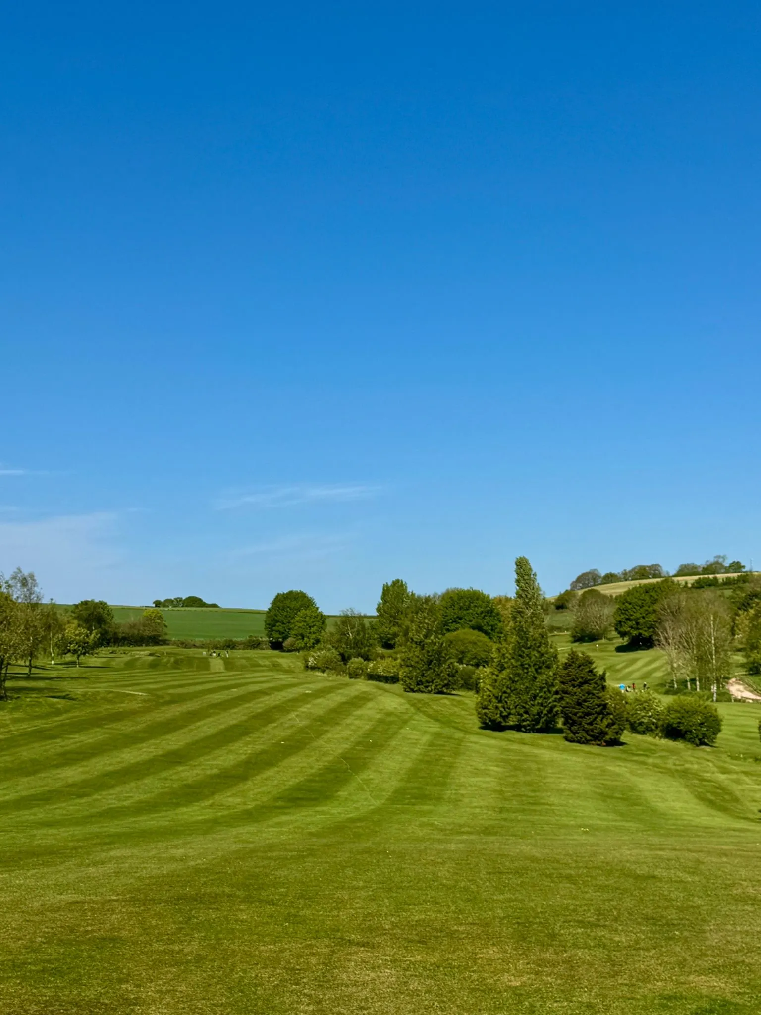 Lush green fairway and rolling Devon countryside at Exminster