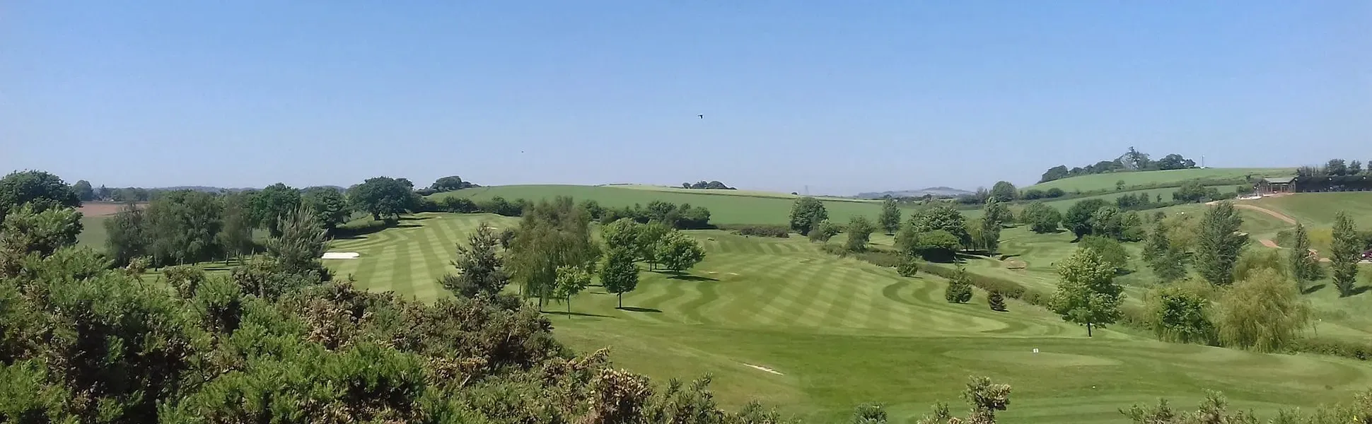 Panoramic view of the fairways and Devon hills at Exminster