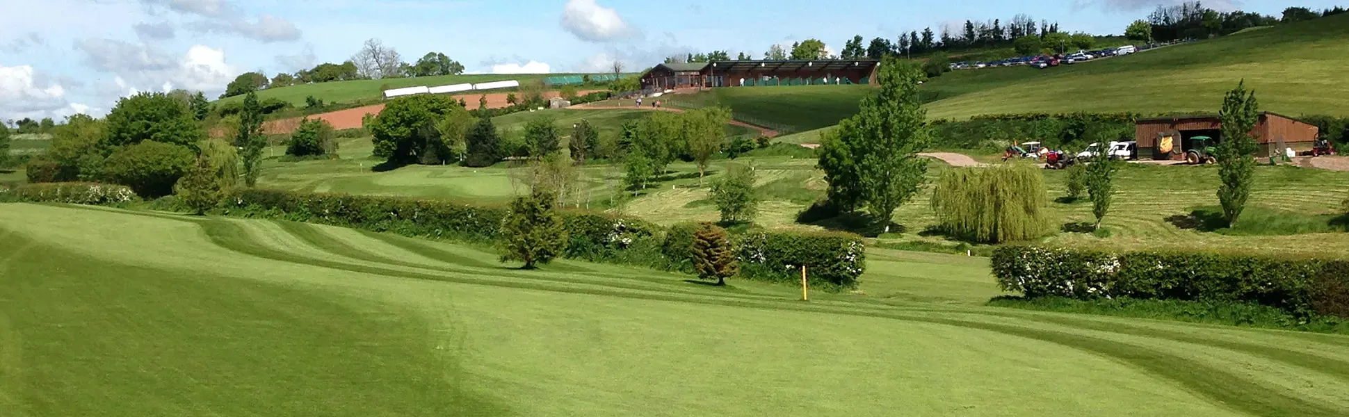 Fairways with the clubhouse beyond at Exminster Golf Centre